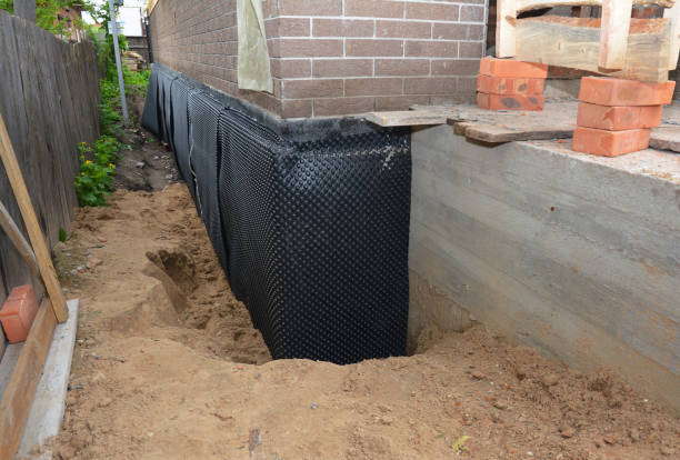 Happy homeowners after waterproofing job in Williams